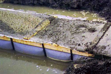 Fab-Form Fastfoot Prevents Ground Water Contamination, Fabric Formwork for concrete footings and pad edging in CO